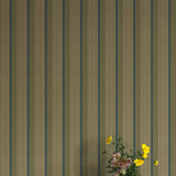 Vase of flowers against wallpaper with vertical stripes in green, blue and brown