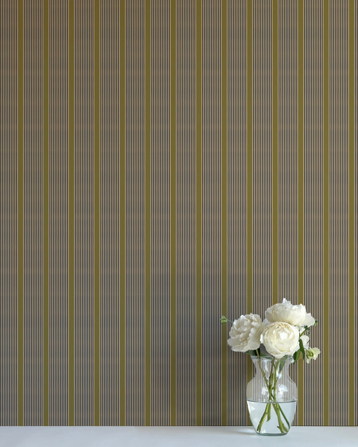 Striped wallpaper with a vase of flowers on a plain surface