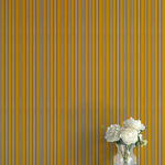 Striped wallpaper with a vase of flowers on a flat surface