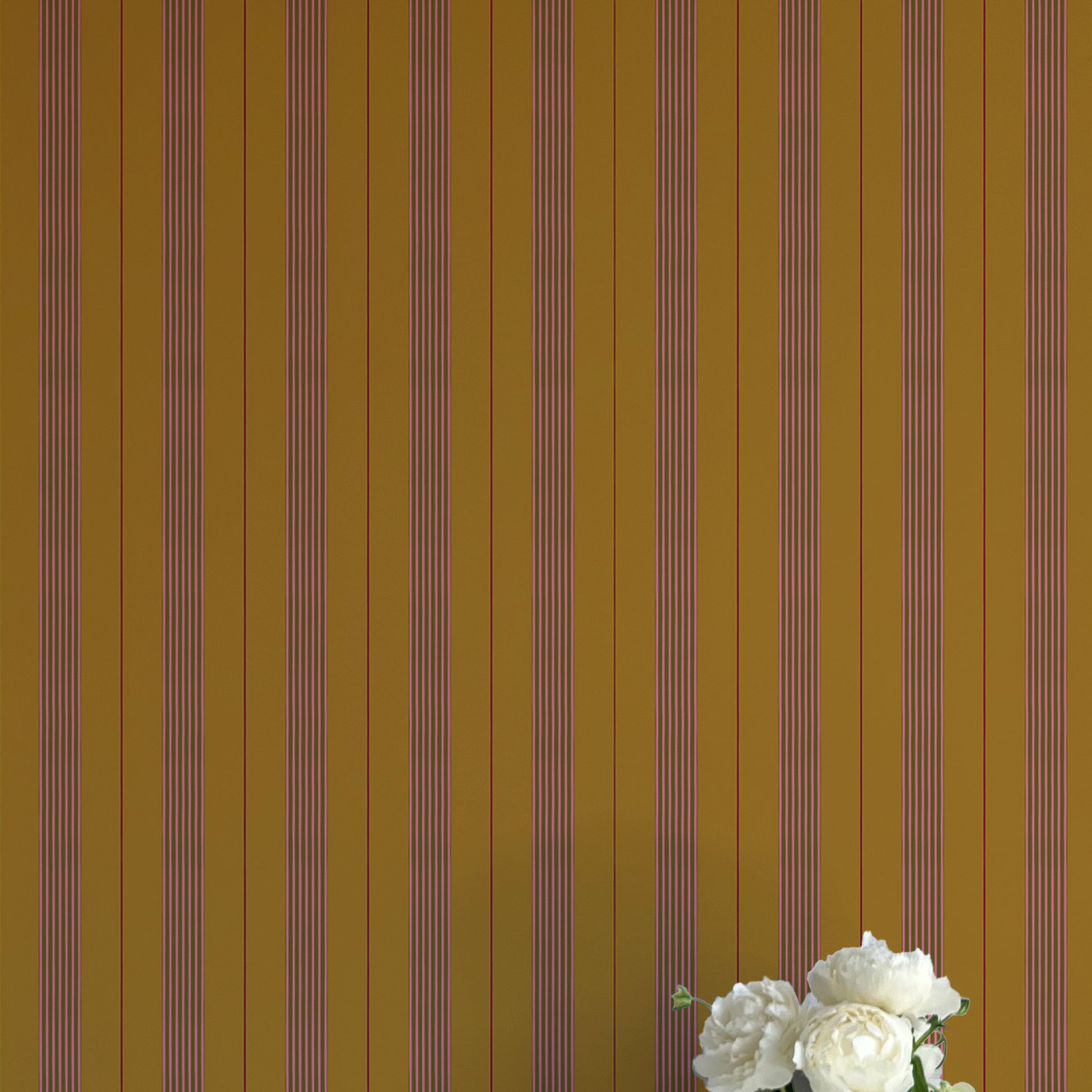 Striped wallpaper with a vase of flowers in the foreground