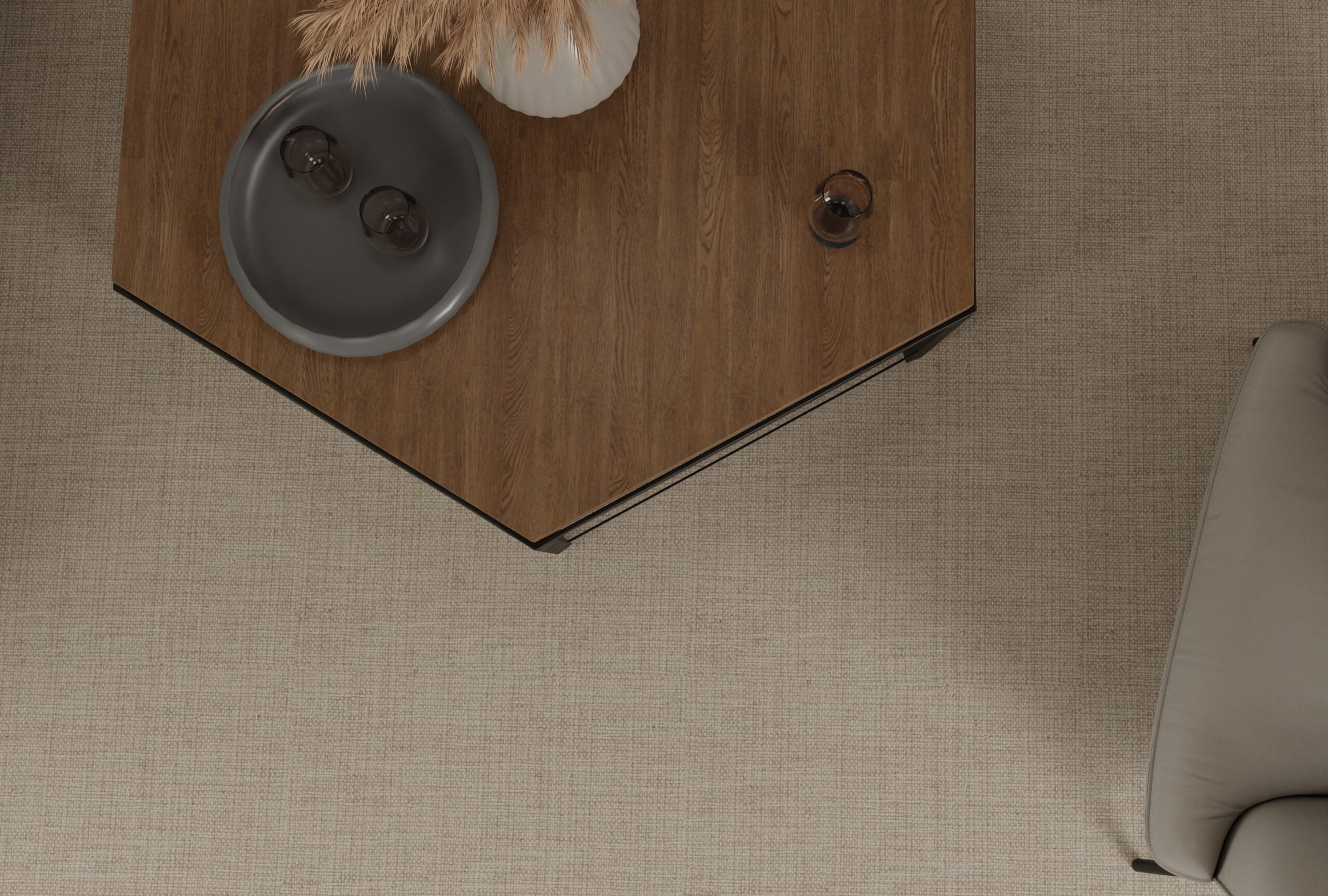 Overhead image of a angled wood coffee table over a beige broadloom carpet. 