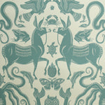 Teal animal and nature-themed pattern on a beige background