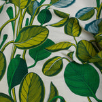 Fabric with green leaf pattern on a white background