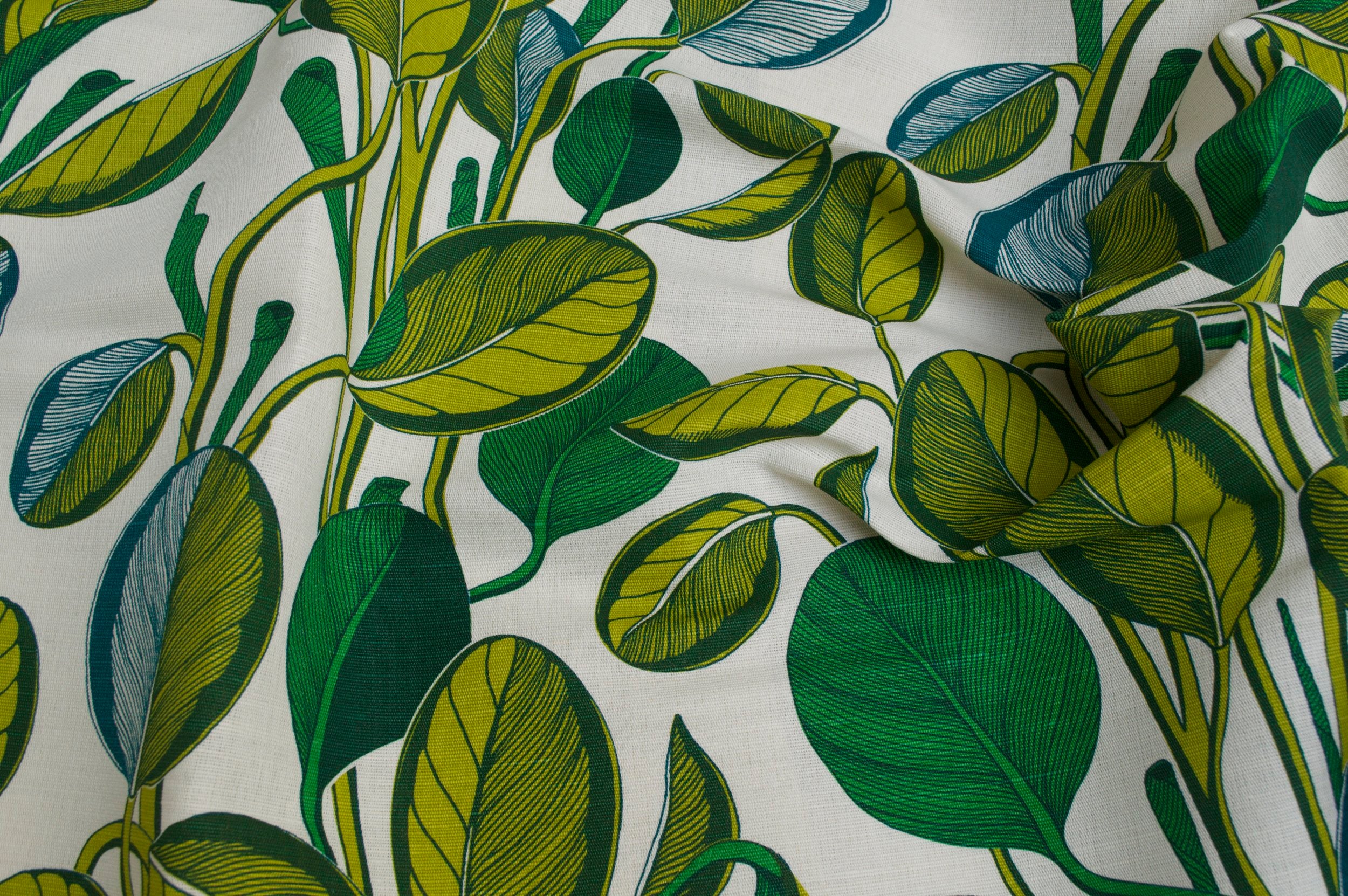 Fabric with green leaf pattern on a white background
