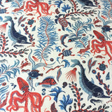 Ocean-themed fabric pattern with red, blue, and black sea creatures on a white background.