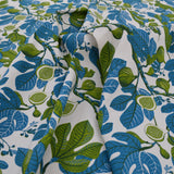 Fabric with blue and green leaf pattern on a white background