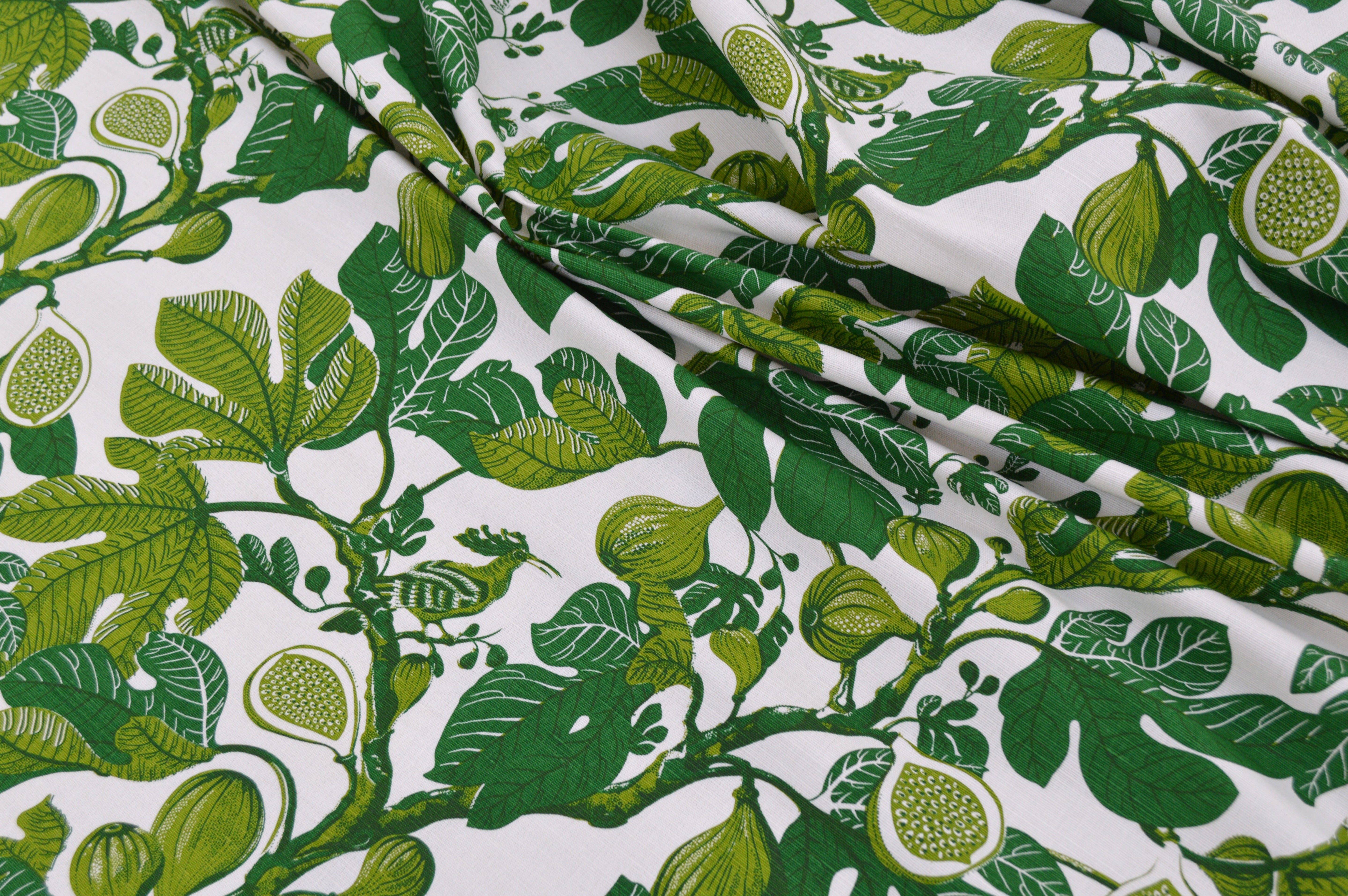 Green leaf pattern fabric on a white background