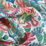Colorful fabric with ocean-themed pattern featuring animals and plants.