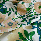 Floral fabric with green leaves and pink flowers on a white background