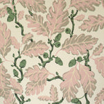 Pattern of pink leaves and green branches on a beige background