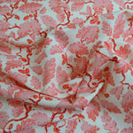 Pink floral patterned fabric on a white background