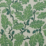 Patterned fabric with  green leaves and green acorns on a light background