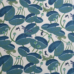 Pattern of blue lily pads and small creatures on a white background
