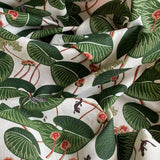 Fabric with green leaf pattern on a white background