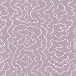 Detail of wallpaper in a minimalist wood grain print in white on a purple field.