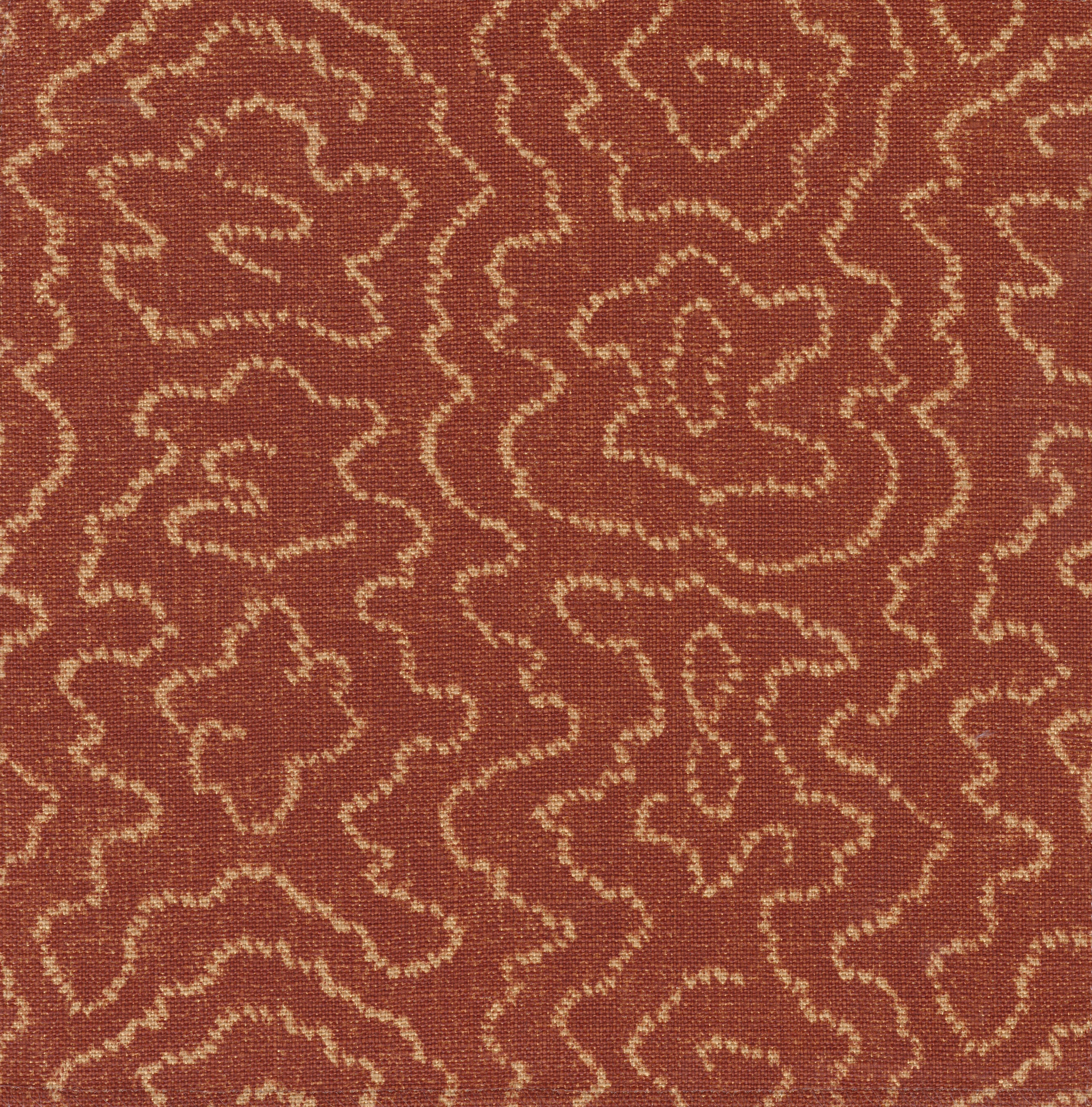 Detail of fabric in a minimalist wood grain print in tan on a rust field.