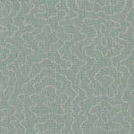 Detail of fabric in a minimalist wood grain print in gray on a pastel turquoise field.