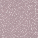 Detail of fabric in a minimalist wood grain print in white on a lavender field.