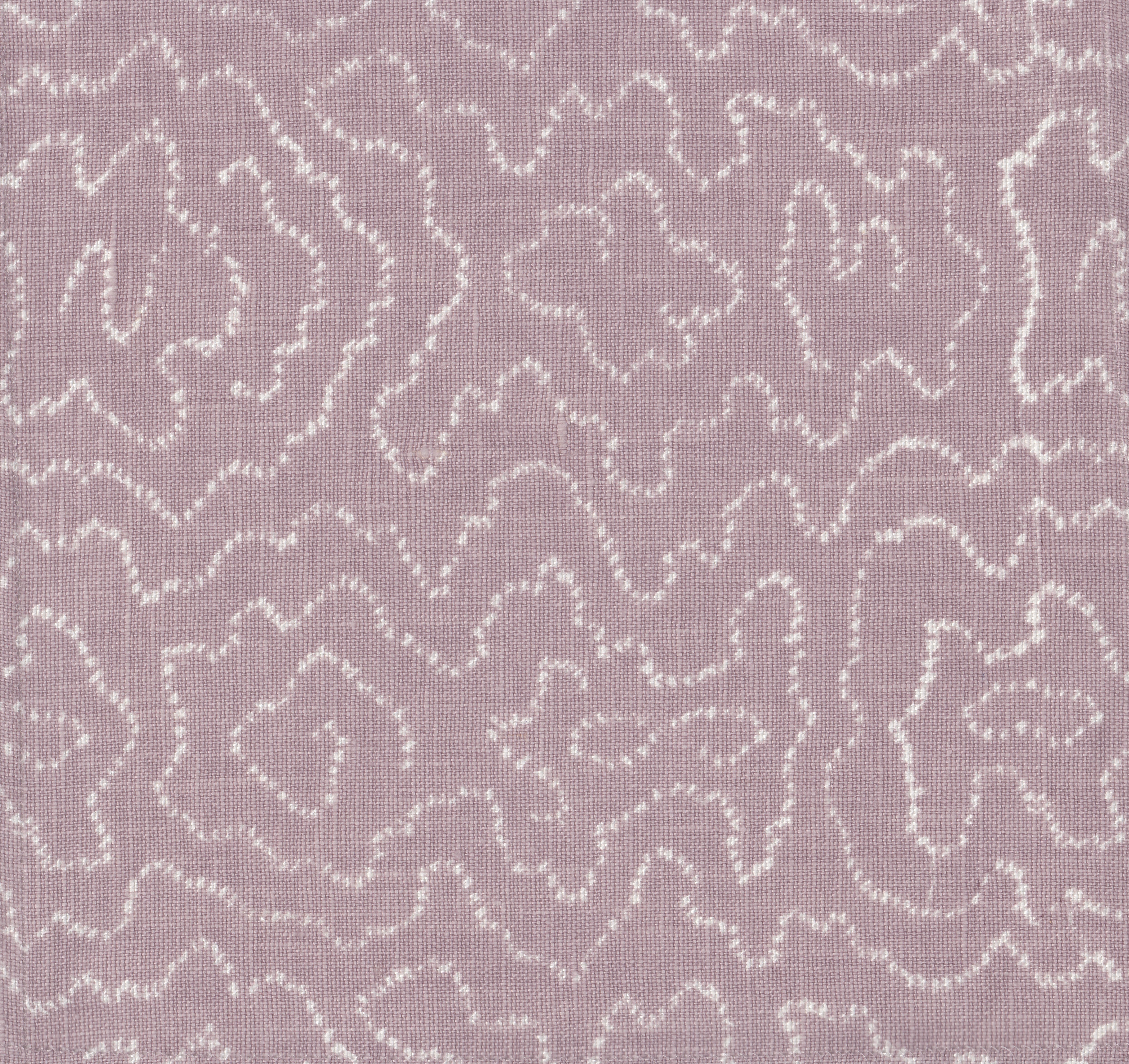 Detail of fabric in a minimalist wood grain print in white on a lavender field.