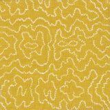 Detail of fabric in a minimalist wood grain print in white on a mustard field.