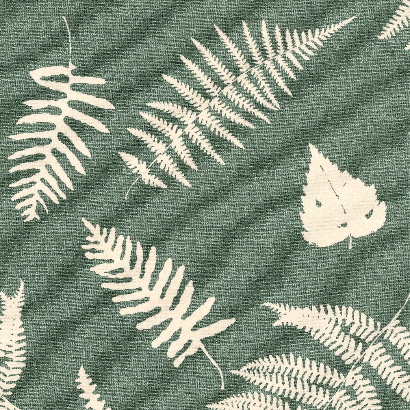 Detail of fabric in a repeating fern and dragonfly print in cream on a dark green field.