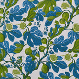 Pattern of blue and green leaves and fruits on a white background