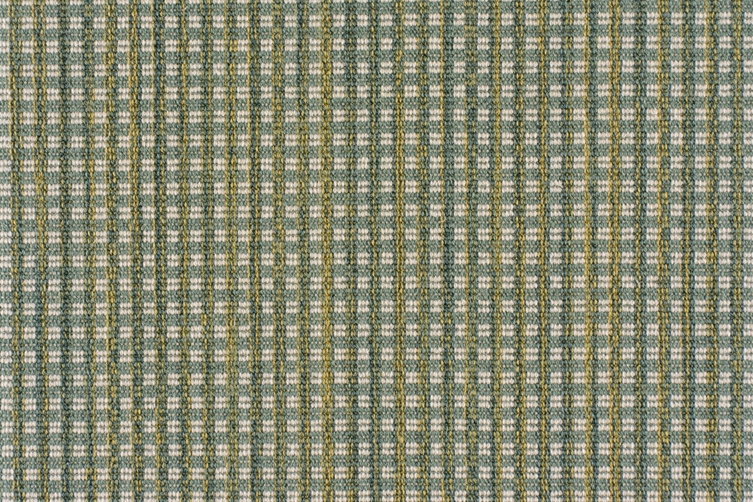 Broadloom carpet with a green and beige checkered pattern