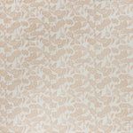 printed cotton fabric in a repeating fish and leaf pattern in peach on a cream field.