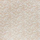 printed cotton fabric in a repeating fish and leaf pattern in peach on a cream field.