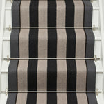 Striped flatweave runner in black and white on white staircase