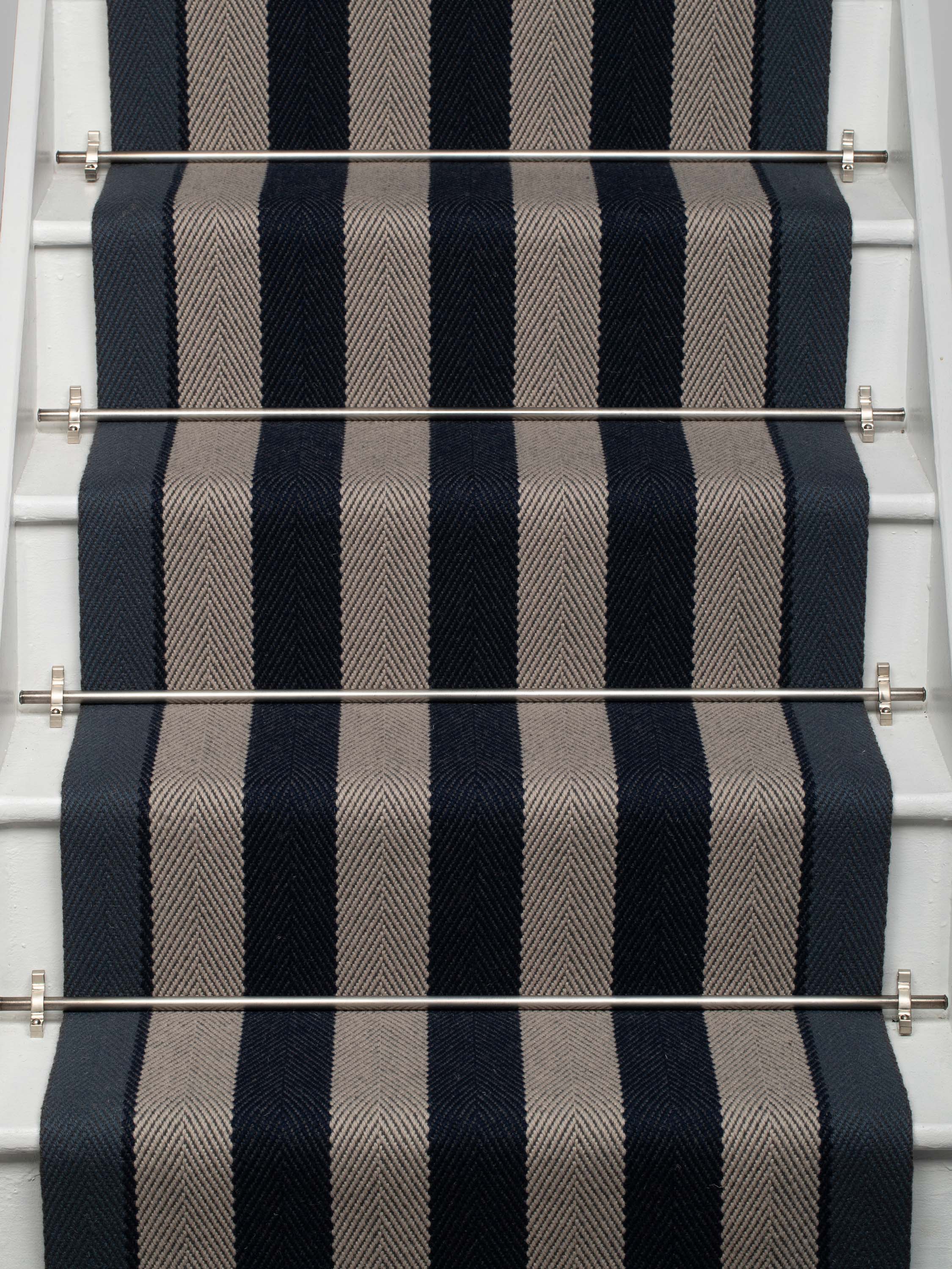 Striped flatweave runner in dark blue and grey on white staircase