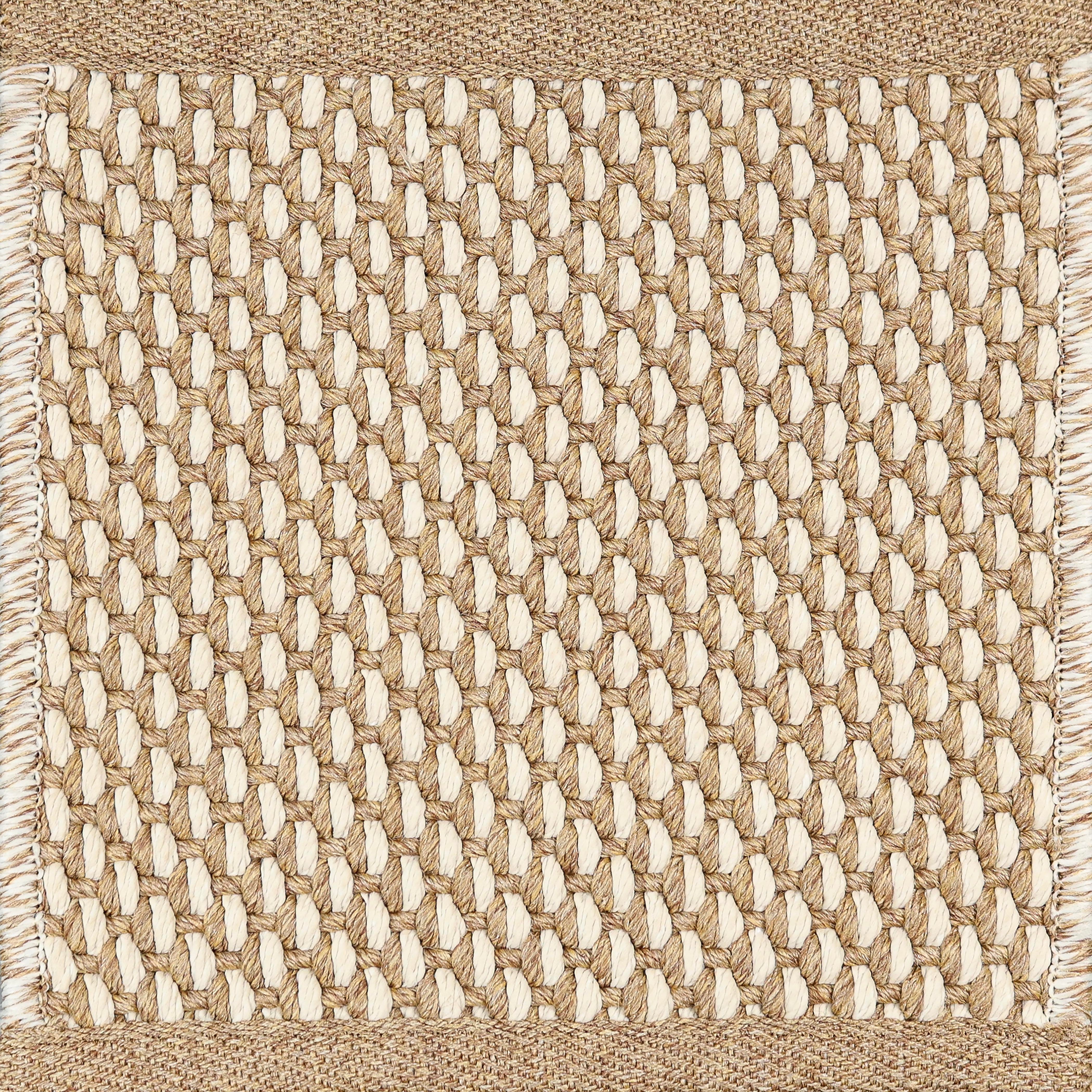 Close-up of woven carpet with a grid pattern tan and white.