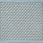 Close-up of woven carpet with a grid pattern in blue, grey and white.