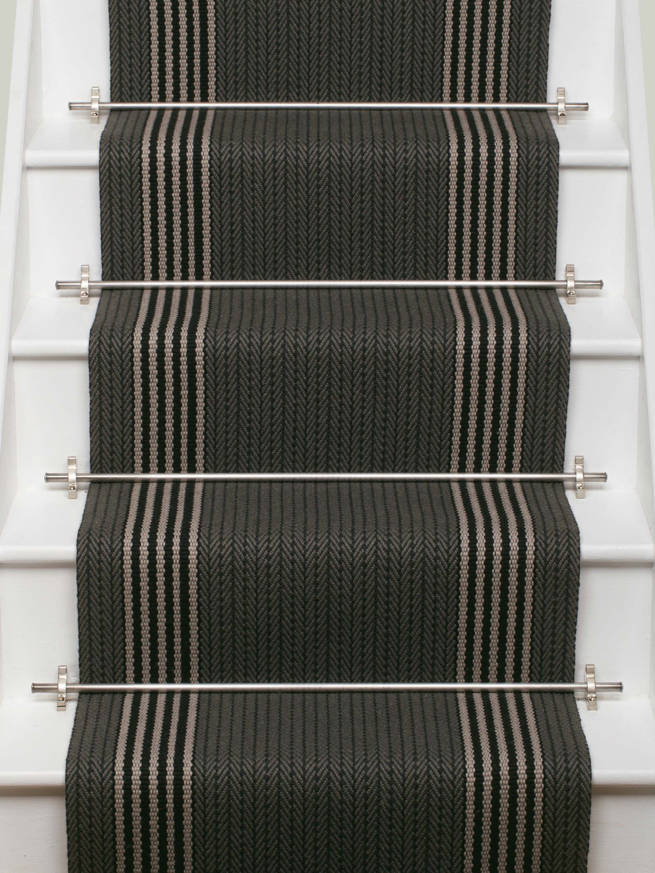 Striped flatweave runner in dark grey and white and black on white staircase