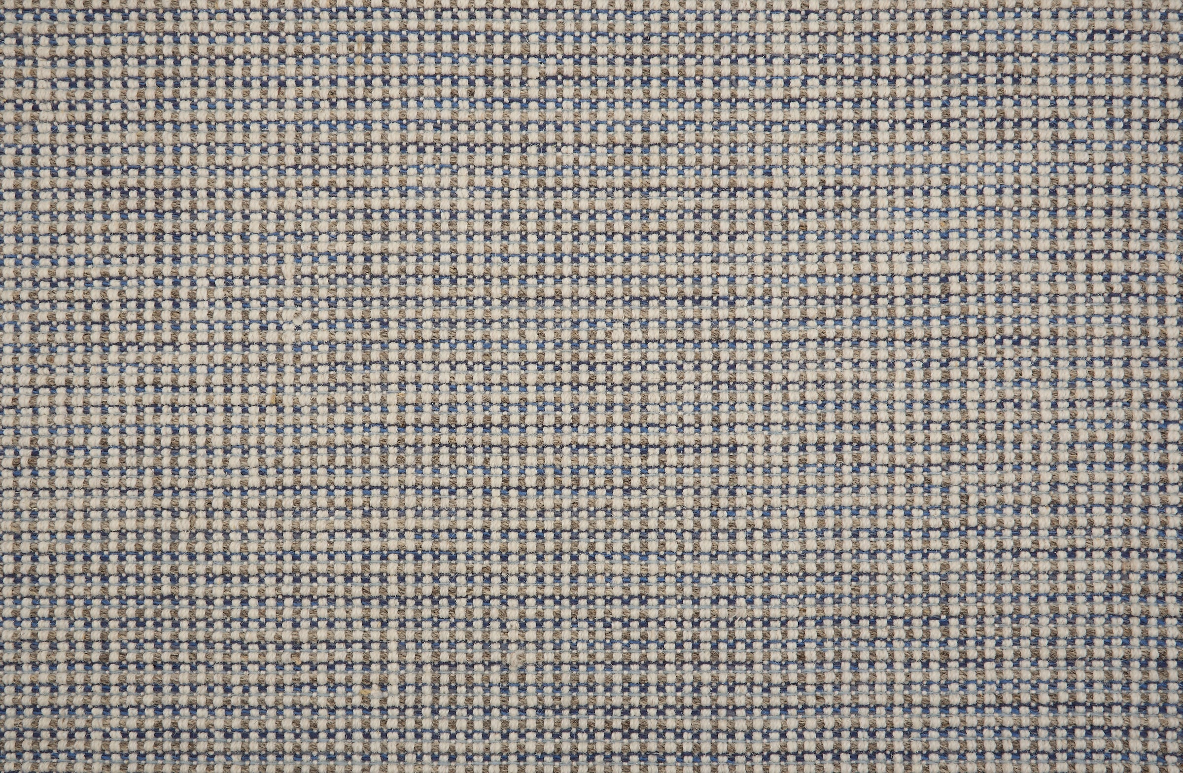 Broadloom carpet in a textural basketweave in cream, grey and blue.
