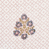 Detail of fabric in a lattice print with floral accents in pink, blue and green on a white field.