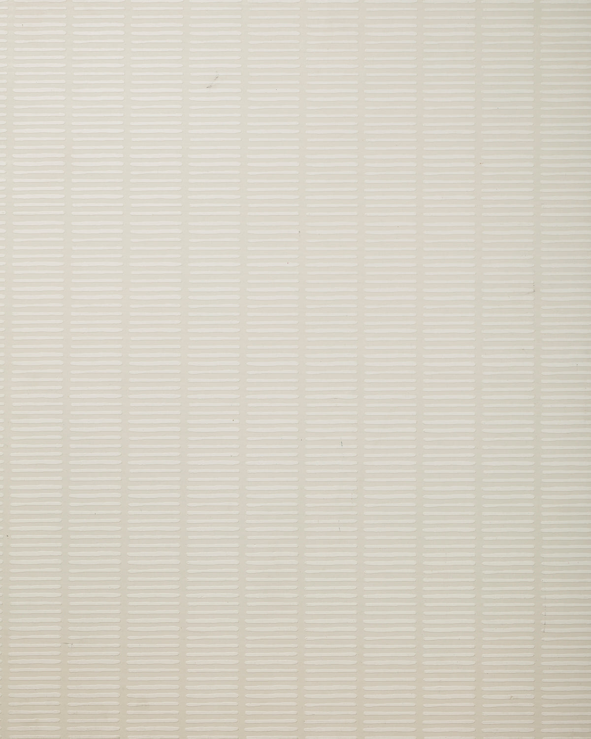 Detail of wallpaper in a textural stripe print in cream.