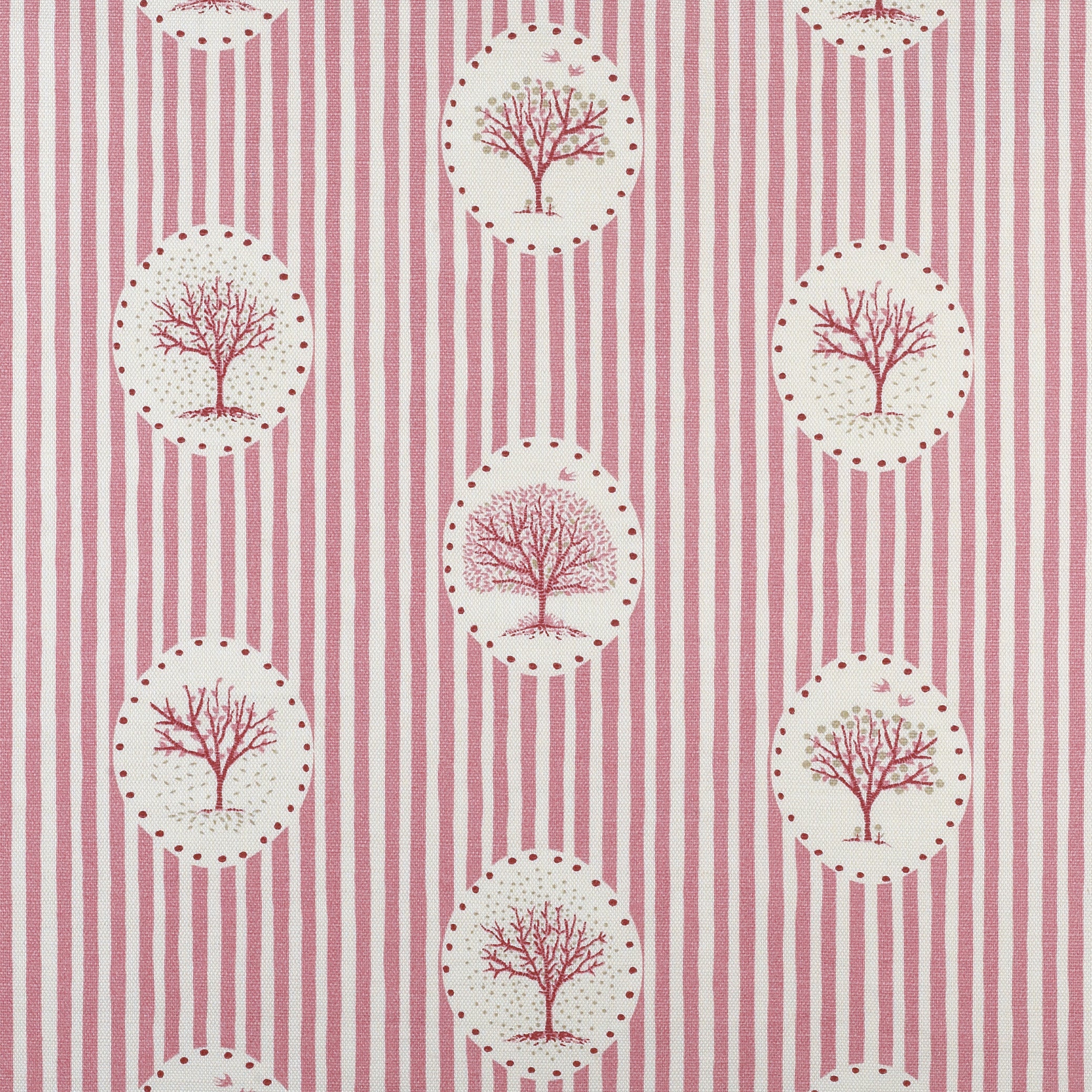 Detail of fabric in a repeating tree and stripe print in shades of pink on a cream field.