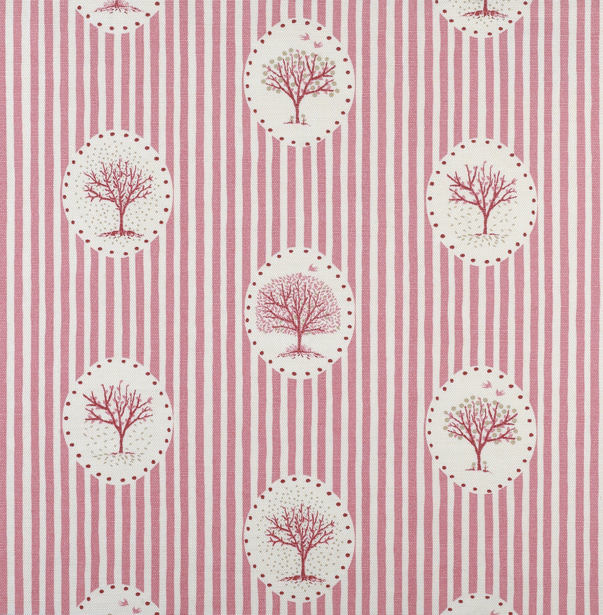 Detail of fabric in a repeating tree and stripe print in shades of pink on a cream field.