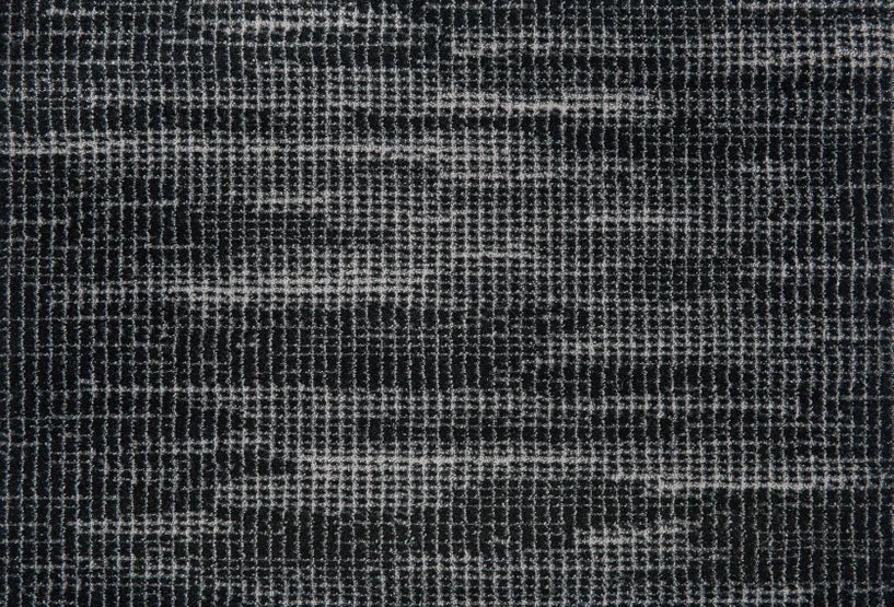 Broadloom carpet swatch in a textured pattern black white color