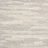 Broadloom carpet swatch in a textured pattern light grey color