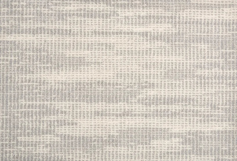 Broadloom carpet swatch in a textured pattern light grey color