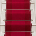 Striped flatweave runner in red on white staircase