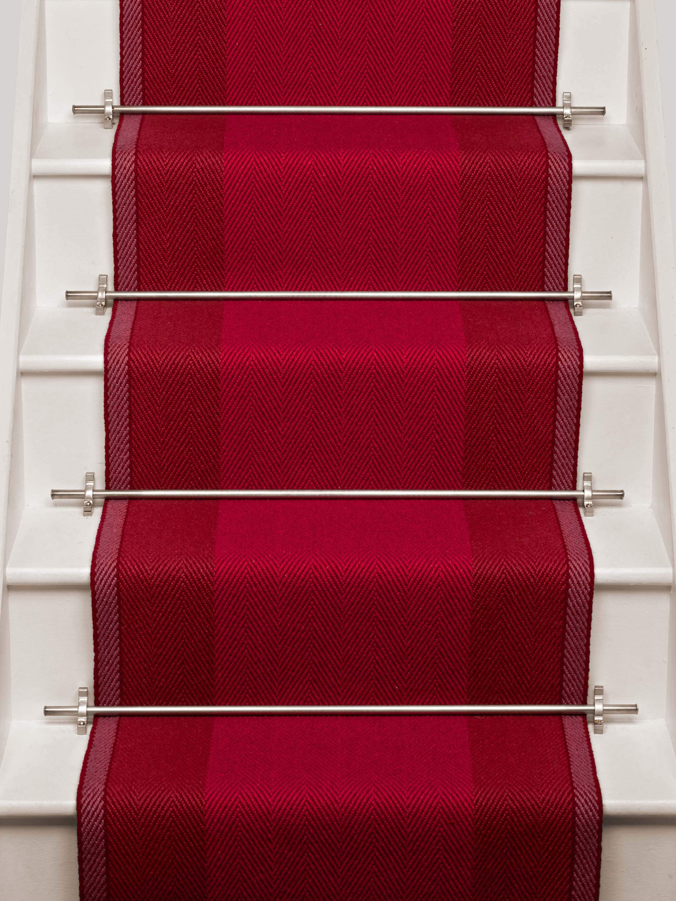 Striped flatweave runner in red on white staircase