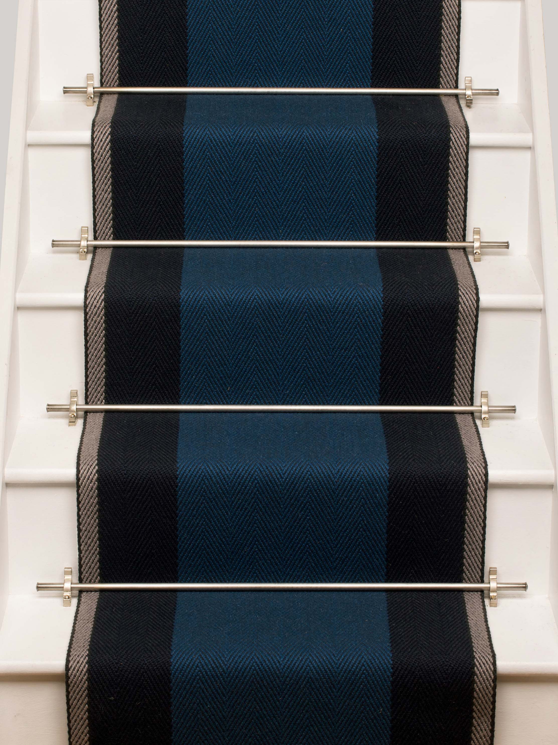 Striped flatweave runner in blue and grey on white staircase