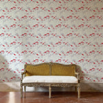 Decorative bench against a red and grey floral wallpapered wall