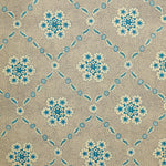 Detail of wallpaper in an intricate floral lattice print in blue on a tan field.