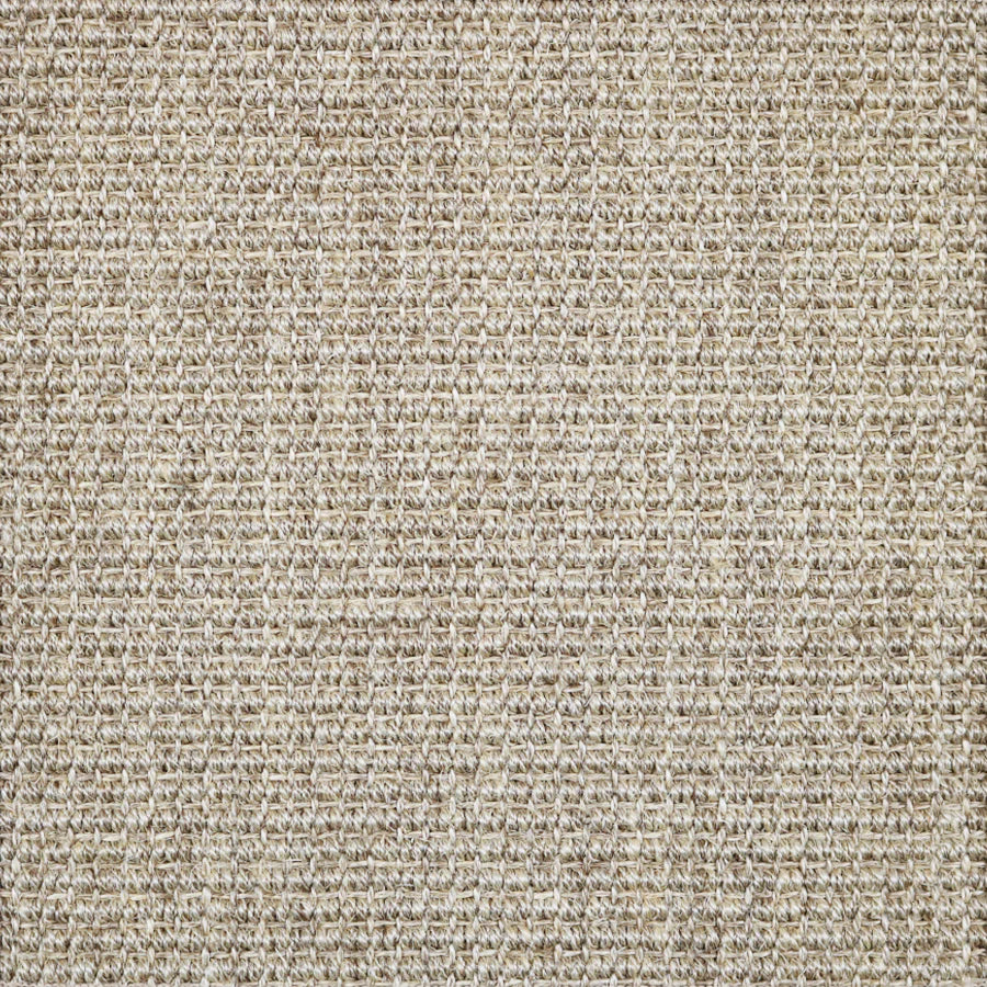 Broadloom carpet in textural woven sisal in oatmeal beige.