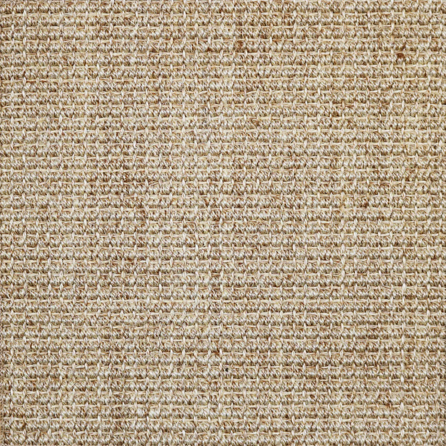 Broadloom carpet in textural woven sisal in tan.