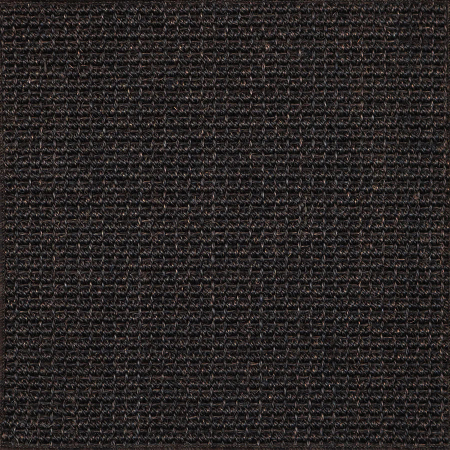 Broadloom carpet in textural woven sisal in deep brown-black.